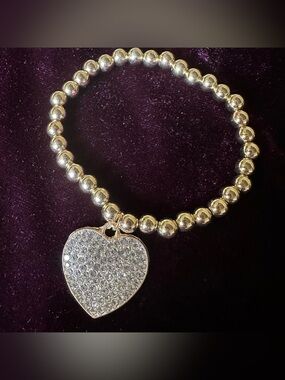 Silver tone bead stretchy rhinestone heart bracelet.